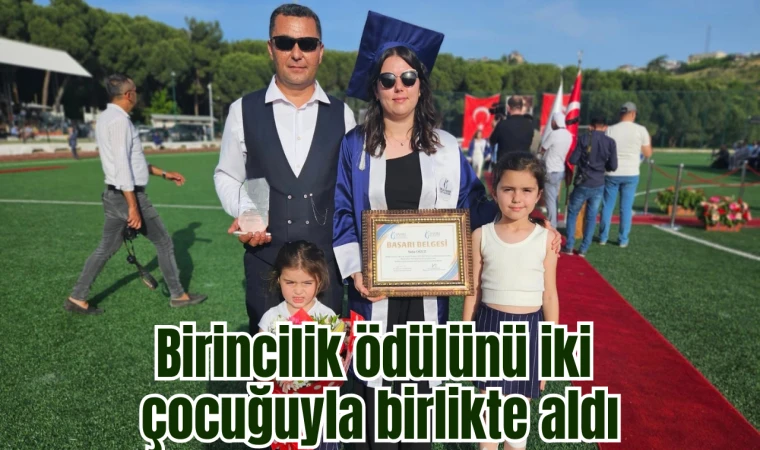 Birincilik ödülünü iki çocuğuyla birlikte aldı